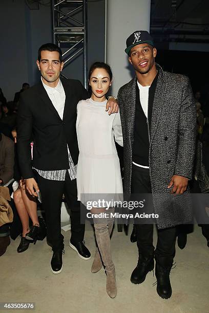 Actors Jesse Metcalfe and Cara Santana pose with New York Giants, Victor Cruz at Public School runway show during MADE Fashion Week Fall 2015 at...