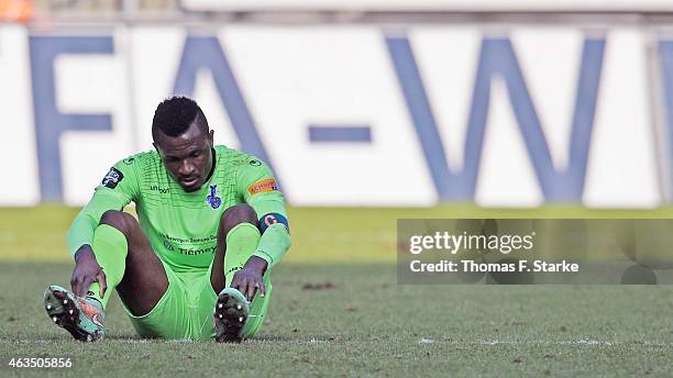 Kingsley Onuegbu of Duisburg sits on the pitch after losing the Third League match between Arminia Bielefeld and MSV Duisburg at Schueco Arena on...