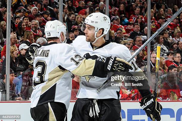 Nick Spaling and Brandon Sutter of the Pittsburgh Penguins celebrate after Spaling scored against the Chicago Blackhawks in the third period during...