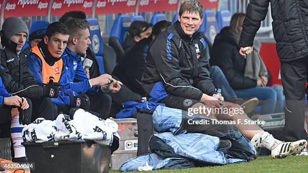 Fabian Klos of Bielefeld smiles sitting on the substitutes bench during the Third League match between Arminia Bielefeld and MSV Duisburg at Schueco...