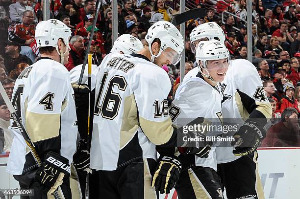 The Pittsburgh Penguins celebrate, including Brandon Sutter and Beau Bennett, after scoring against the Chicago Blackhawks in the third period during...