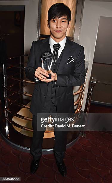 Kwang-Ho Hong, winner of Best Supporting Actor in a Musical for "Miss Saigon", poses in the press room at the WhatsOnStage Awards at The Prince of...