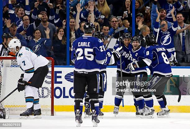 Martin St. Louis of the Tampa Bay Lightning, second from right, celebrates his third goal of the period with teammates including Mark Barberio, J.T....