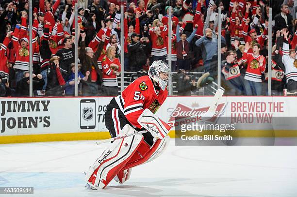 Goalie Corey Crawford of the Chicago Blackhawks celebrates after the Blackhawks defeated the Pittsburgh Penguins 2-1 during the NHL game at the...