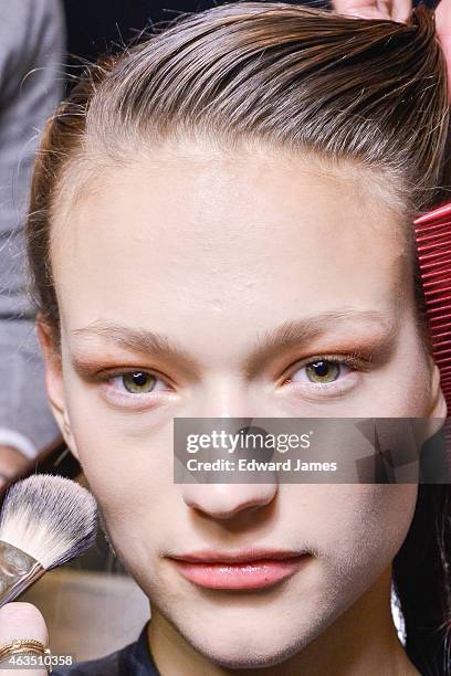 Model poses backstage at the Herve Leger by Max Azria fashion show at The Theatre at Lincoln Center on February 14, 2015 in New York City.