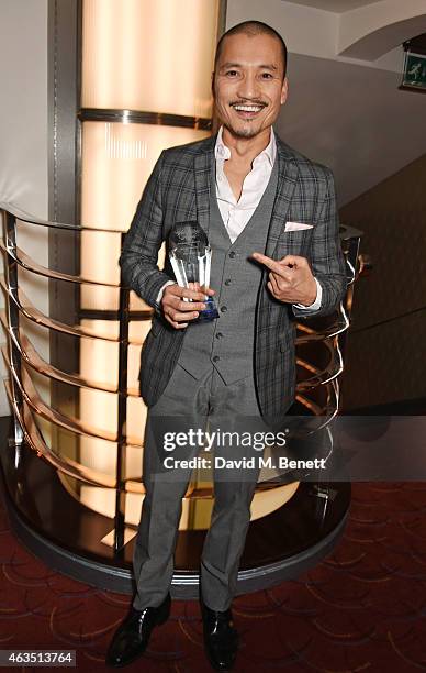 Jon Jon Briones, winner of Best Actor in a Musical for "Miss Saigon", poses in the press room at the WhatsOnStage Awards at The Prince of Wales...