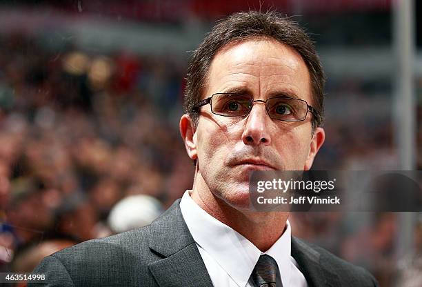 Assistant coach Doug Lidster of the Vancouver Canucks looks on from the bench during their NHL game against the Boston Bruins at Rogers Arena...