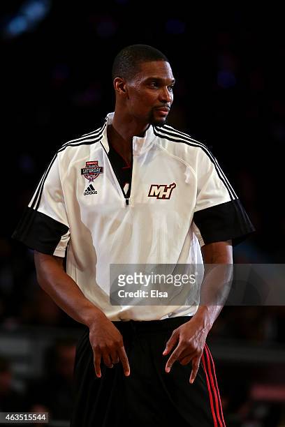 Chris Bosh of the Miami Heat and the Eastern Conference reacts during the Degree Shooting Stars Competition as part of the 2015 NBA Allstar Weekend...
