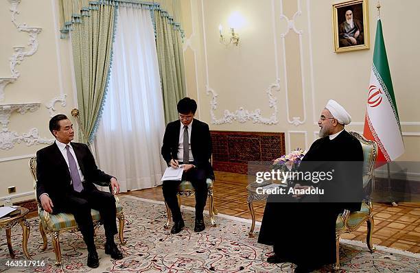 Chinese Foreign Minister Wang Yi meets with Iranian President Hassan Rouhani at the Iranian presidency office in Tehran, Iran, on February 15, 2015.