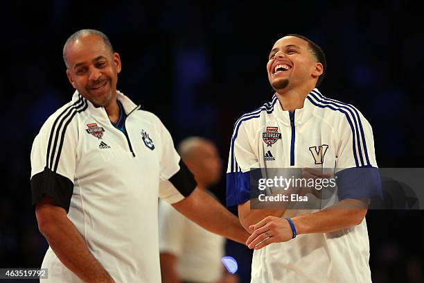 Stephen Curry of the Golden State Warriors and of the Western Conference jokes with his father and NBA Legend Dell Curry during the Degree Shooting...