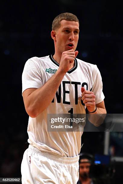 Mason Plumlee of the Brooklyn Nets looks on during the Sprite Slam Dunk Contest as part of the 2015 NBA Allstar Weekend at Barclays Center on...