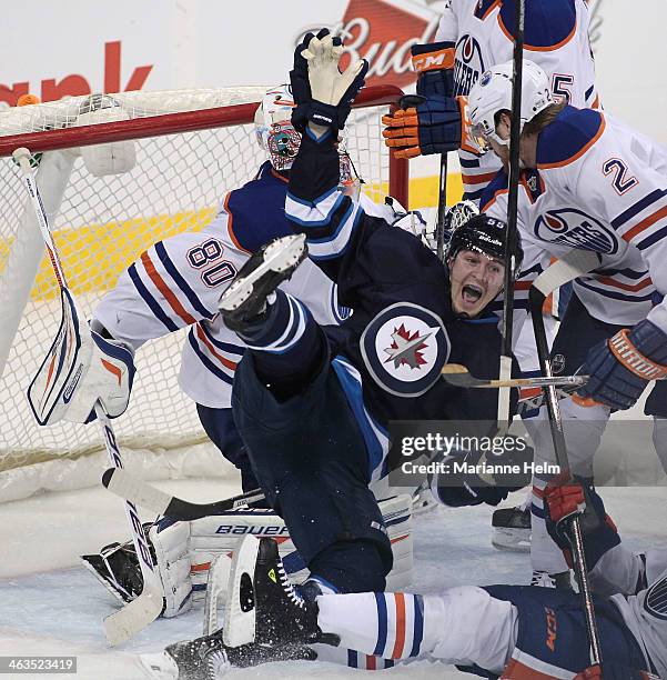 Mark Scheifele of the Winnipeg Jets celebrates his goal against Ilya Bryzgalov of the Edmonton Oilers in third period action in an NHL game at the...