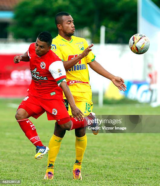 Jhon Varela of Cortulua struggles for the ball with Felipe Alarcon of Atletico Huila during a match between Cortulua and Atletico Huila as part of...