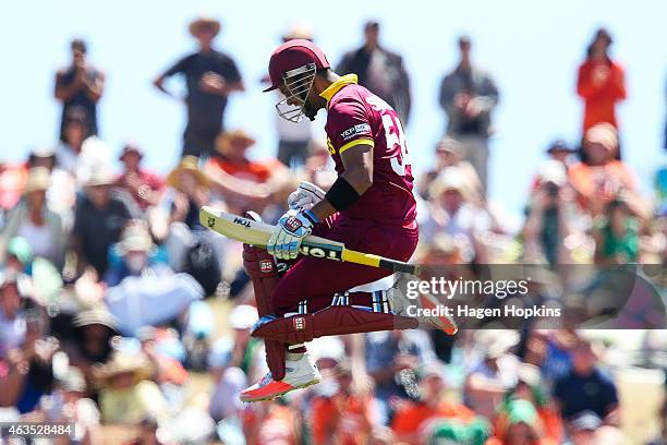 Lendl Simmons of the West Indies celebrates his century during the 2015 ICC Cricket World Cup match between the West Indies and Ireland at Saxton...