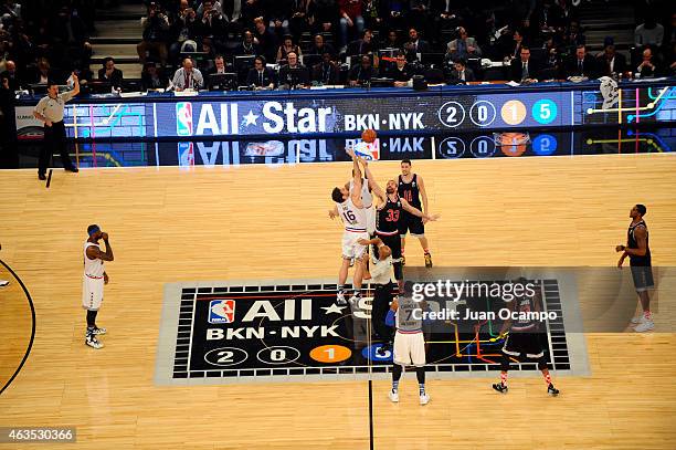 Pau Gasol of the Eastern Conference All-Stars battles Marc Gasol of the Western Conference All-Stars for the jump ball during the 2015 NBA All-Star...
