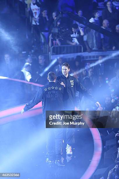 Pau Gasol of the Eastern Conference shakes hands with his brother Marc Gasol of the Western Conference during the 2015 NBA All-Star Game as part of...