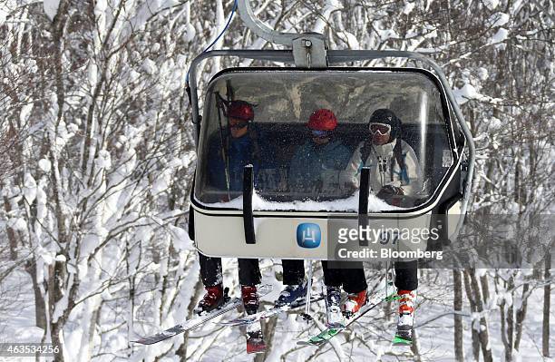 Skiers ride on a lift at the Niseko Hanazono resort, operated by Nihon Harmony Resorts KK, in Kutchan, Hokkaido, Japan, on Sunday, Feb. 15, 2015. The...