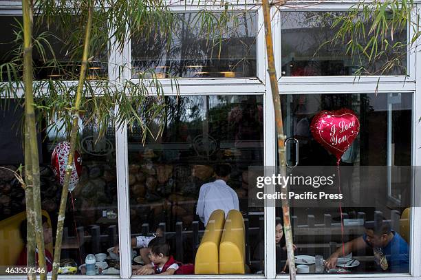 Families, couples and partners celebrate Valentine's day in a restaurant in Tagaytay city. Most restaurants in the city also offer a great view of...