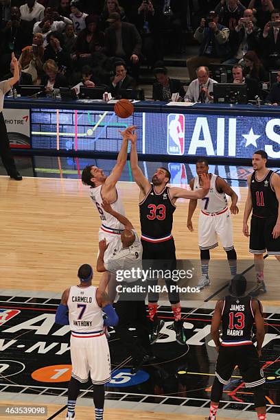 Marc Gasol of the Western Conference All-Stars battles Pau Gasol of the Eastern Conference All-Stars for the jump ball during the 2015 NBA All-Star...