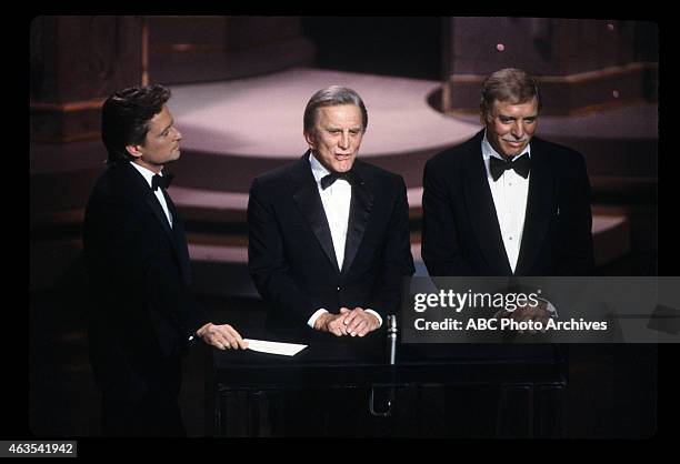 Airdate: March 25, 1985. MICHAEL DOUGLAS WITH FATHER KIRK DOUGLAS AND BURT LANCASTER, PRESENTERS WRITING AWARDS