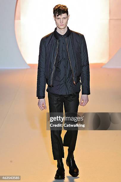 Model walks the runway at the Wooyoungmi Autumn Winter 2014 fashion show during Paris Menswear Fashion Week on January 18, 2014 in Paris, France.