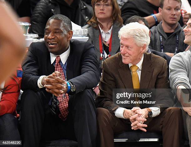 Former president Bill Clinton and Dikembe Mutombo attend The 64th NBA All-Star Game 2015 on February 15, 2015 in New York City.