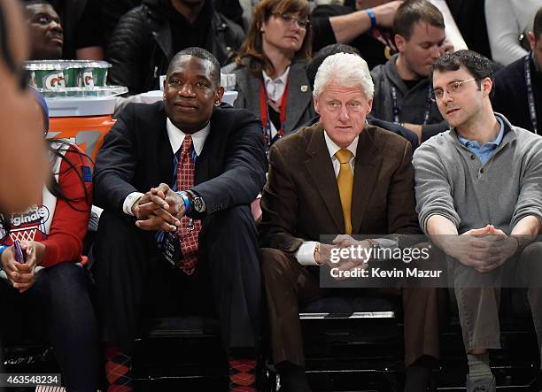 Former president Bill Clinton and Dikembe Mutombo attend The 64th NBA All-Star Game 2015 on February 15, 2015 in New York City.