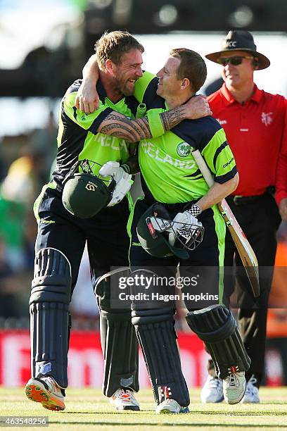 John Mooney and Niall O'Brien of Ireland celebrate after winning the 2015 ICC Cricket World Cup match between the West Indies and Ireland at Saxton...