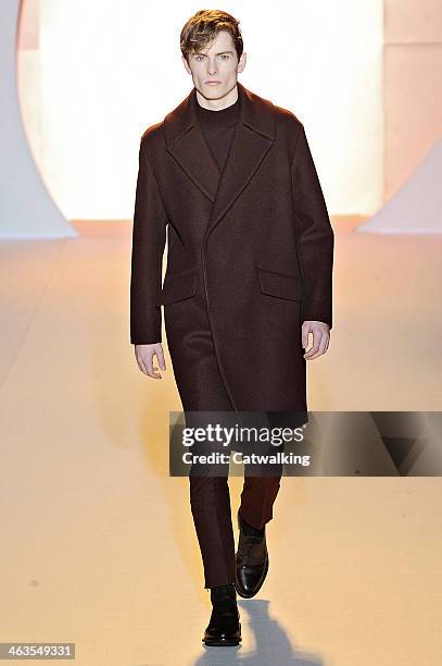 Model walks the runway at the Wooyoungmi Autumn Winter 2014 fashion show during Paris Menswear Fashion Week on January 18, 2014 in Paris, France.