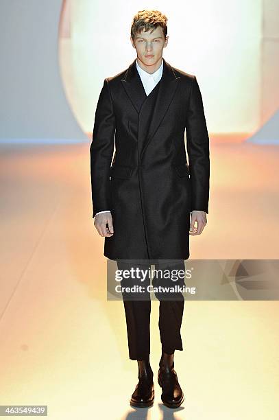 Model walks the runway at the Wooyoungmi Autumn Winter 2014 fashion show during Paris Menswear Fashion Week on January 18, 2014 in Paris, France.