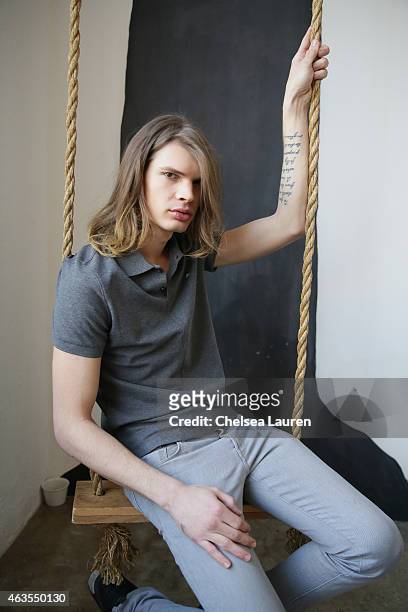 Model Cameron Keesling poses backstage before the Franco Lacosta presentation on February 15, 2015 in New York City.