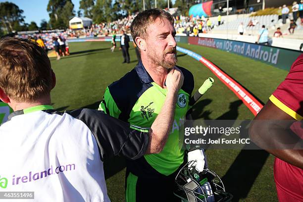 John Mooney of Ireland is congratulated after beating the West Indies during the 2015 ICC Cricket World Cup match between the West Indies and Ireland...