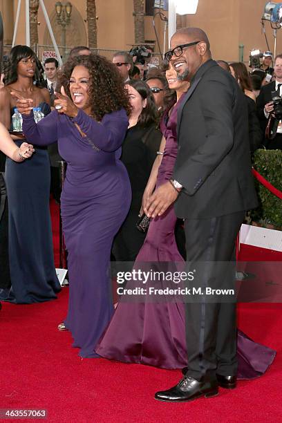 Actress/TV personality Oprah Winfrey, Keisha Whitaker, and Forest Whitaker attend the 20th Annual Screen Actors Guild Awards at The Shrine Auditorium...