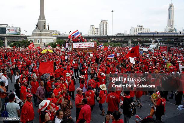 Supporters of Thailand's ousted former premier Thaksin Shinawatra during a march at Victory Monument in Bangkok. About 100 taxi drivers loyal to...