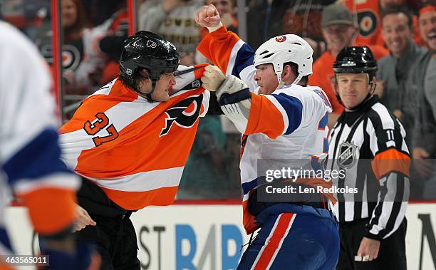 Jay Rosehill of the Philadelphia Flyers fights Eric Boulton of the New York Islanders in the first period on January 18, 2014 at the Wells Fargo...