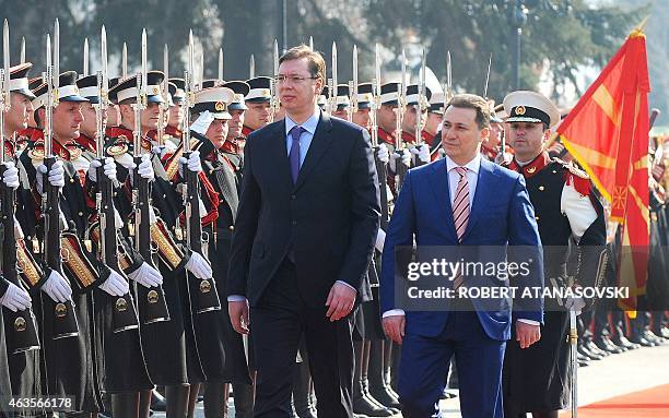 Serbian Prime Minister Alaksandar Vucic and his Macedonian counterpart Nikola Gruevski inspect the honor guard in front of the government building in...