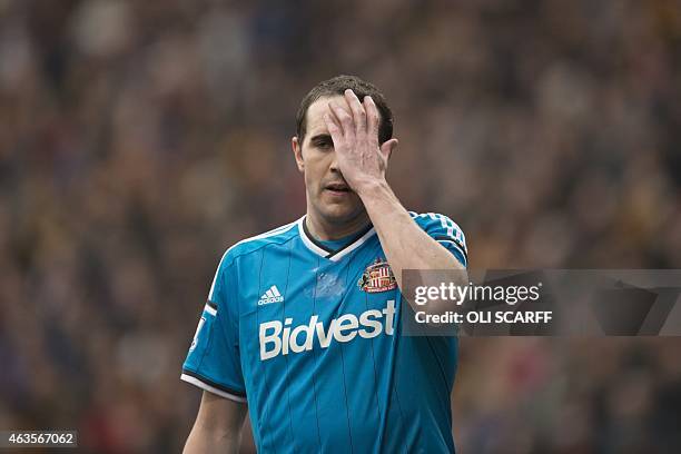 Sunderland's Irish defender John O'Shea holds his head during the FA Cup fifth round football match between Bradford City and Sunderland at The Coral...