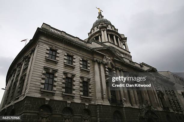 Statue of the scales of justice stands above the Old Bailey on February 16, 2015 in London, England.