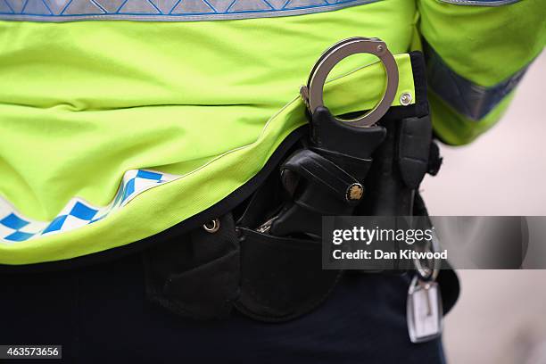 Police Officers stand in Parliament Square on February 15, 2015 in London, England.