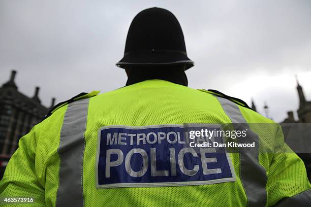 Police Office stands in Parliament Square on February 15, 2015 in London, England.