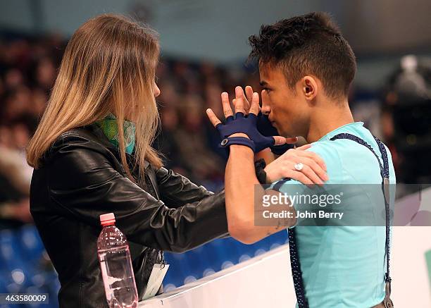 Florent Amodio of France with his coach Katia Krier competes in the Men Free Skating event of the ISU European Figure Skating Championships 2014 held...