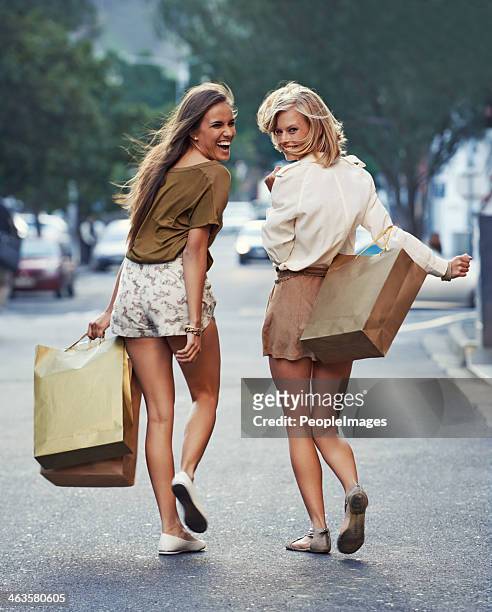follow us to the next sale - young women shopping stock pictures, royalty-free photos & images