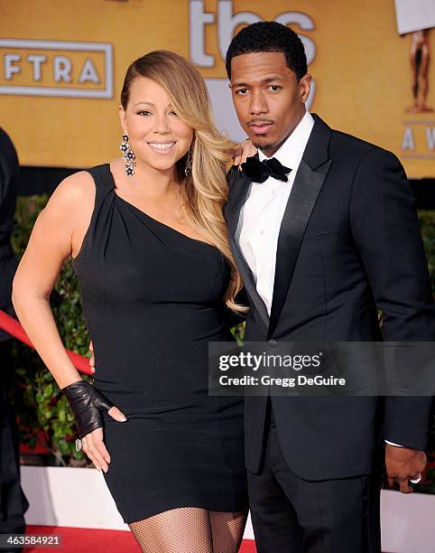 Singer Mariah Carey and actor/TV personality Nick Cannon arrive at the 20th Annual Screen Actors Guild Awards at The Shrine Auditorium on January 18,...