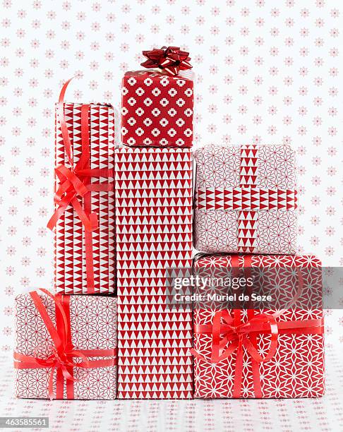 stack of wapped gifts - pile of gifts stock pictures, royalty-free photos & images