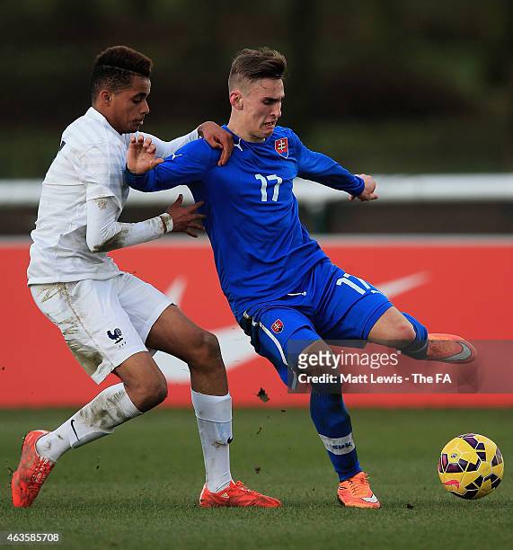Matej Gresak of Slovakia wins the ball from Yassin Fortune of France during the UEFA Under-16 Development Tournament match between Slovakia U16 and...