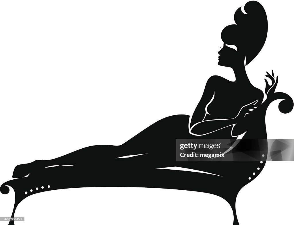 Woman lying on a sofa.