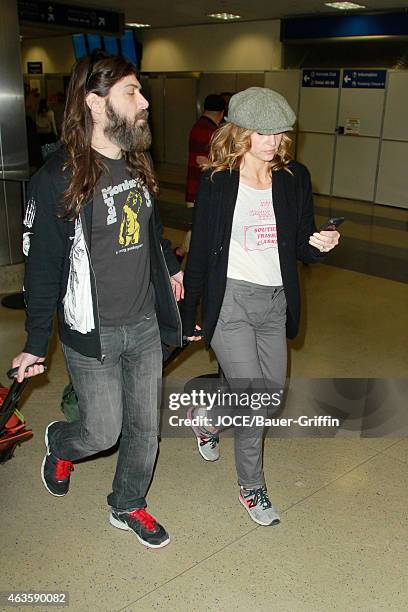 Shooter Jennings and Drea de Matteo are seen at LAX on February 15, 2015 in Los Angeles, California.