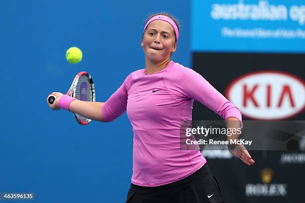 Jelena Ostapenko of Latvia plays a forehand in her first round junior girls' match against Kaylah McPhee of Australia during the 2014 Australian Open...