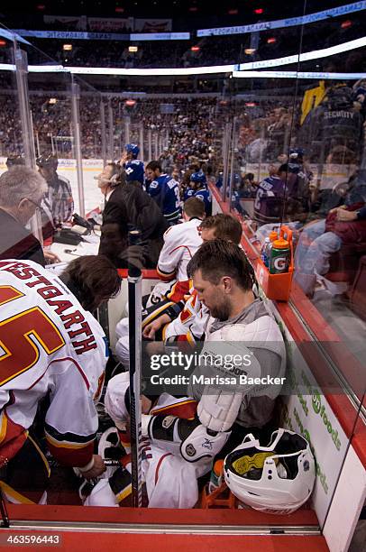 Brian McGrattan of the Calgary Flames sits in the penalty box after the start of the game against the Vancouver Canucks on January 18, 2014 at Rogers...