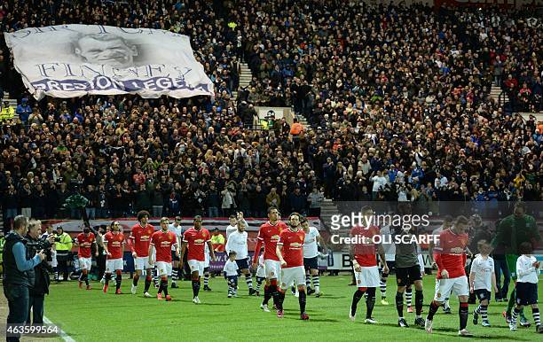The teams walk out ahead of the FA Cup fifth round football match between Preston North End and Manchester United at Deepdale Stadium in Preston,...